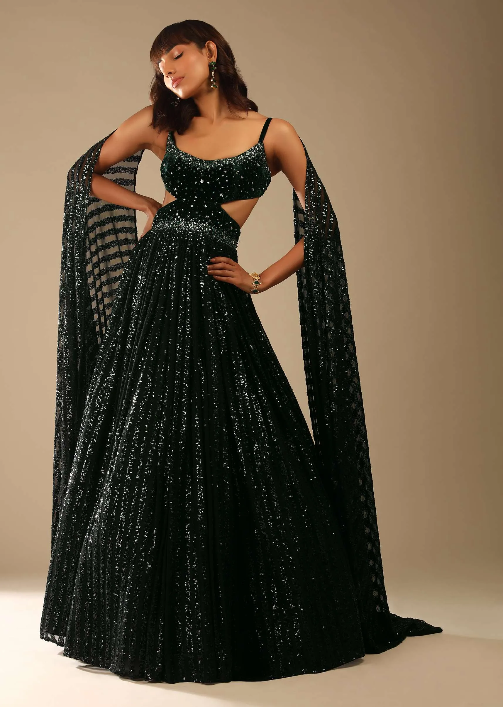 Dark Green Gown Embellished In Sequins With A Velvet Bodice Adorned In Hand Embroidery And Cape On The Shoulder Online - Kalki Fashion
